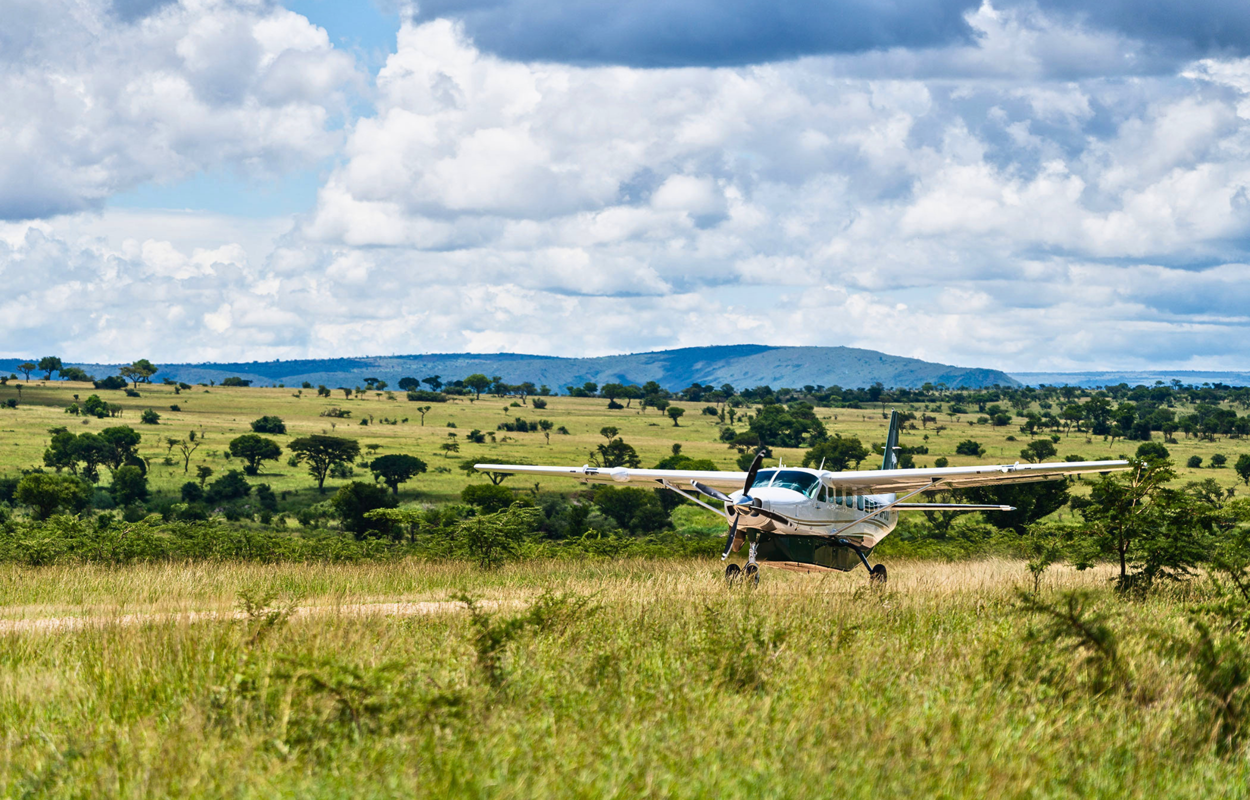 Scenic Bush Flight Charter — Aerial transfer taking in Mount Kilimanjaro and volcanic peaks.